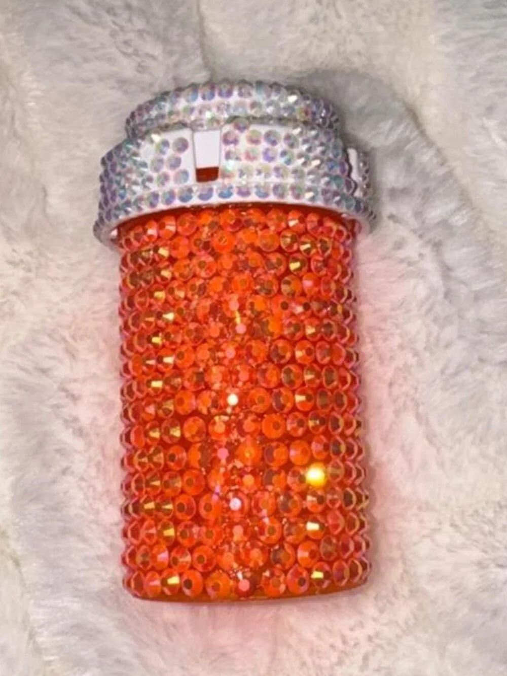 Orange rhinestone bottle with silver cap